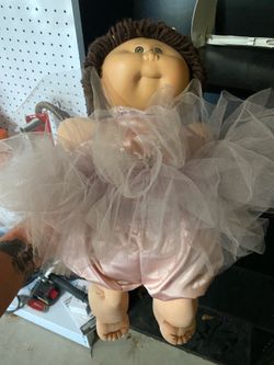 vintage Cabbage Patch Kids doll with stand