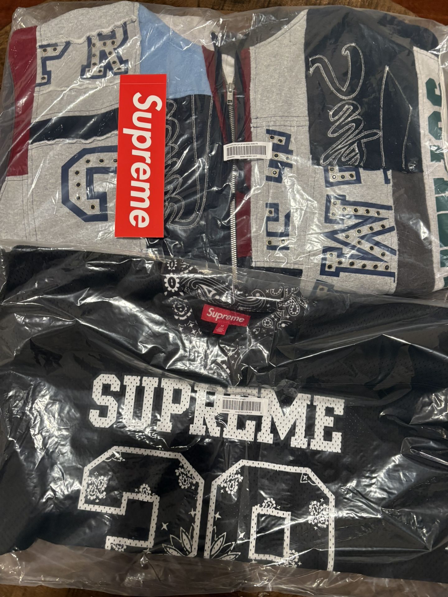 Supreme SS 25 Week 14 BANDANA FOOTBALL JERSEY Black, Blue PATCHWORK ZIP UP HOODED SWEATSHIRT