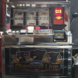 Diamond 777s Slot Machine Works Just Like New .Takes  $1's  $ 5's $10's $20's $50's And $100's Hand Pay Outs $400 