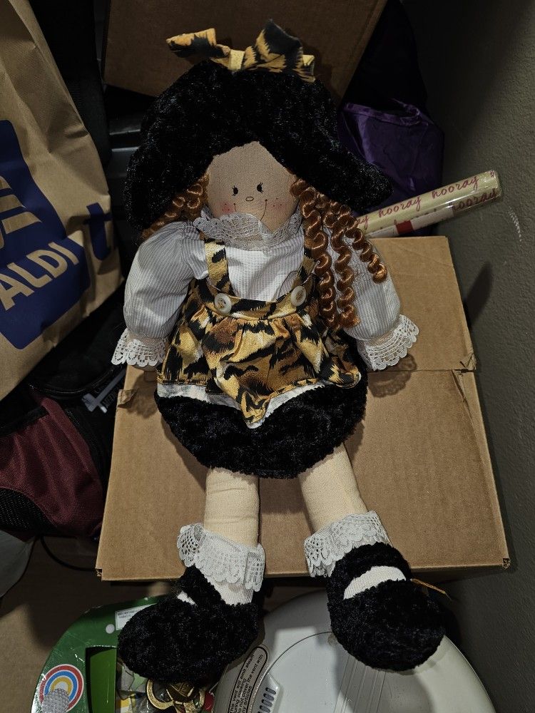 Weighted Cheetah Girl Doll Sits Upright