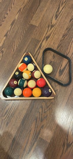 standard pool/billiard balls with the wooden triangle rack and cue ball.