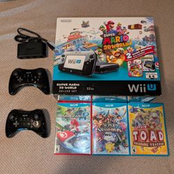 Nintendo Wii U complete in box, with 2 controllers, 3 games, and Gamecube adapter