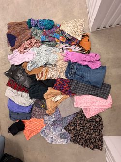 Woman’s 32 Assorted bottoms, dresses and jumpers