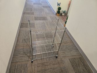 3-tier chrome rolling wire utility cart with heavy duty with a heavey duty swivel stem caster with a side lock brake.
