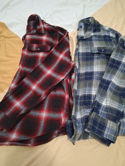 Two flannels one brand new the other one wore once size 2X