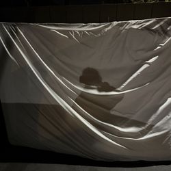 Queen-size mattress with removable zippered cover and box springs. 