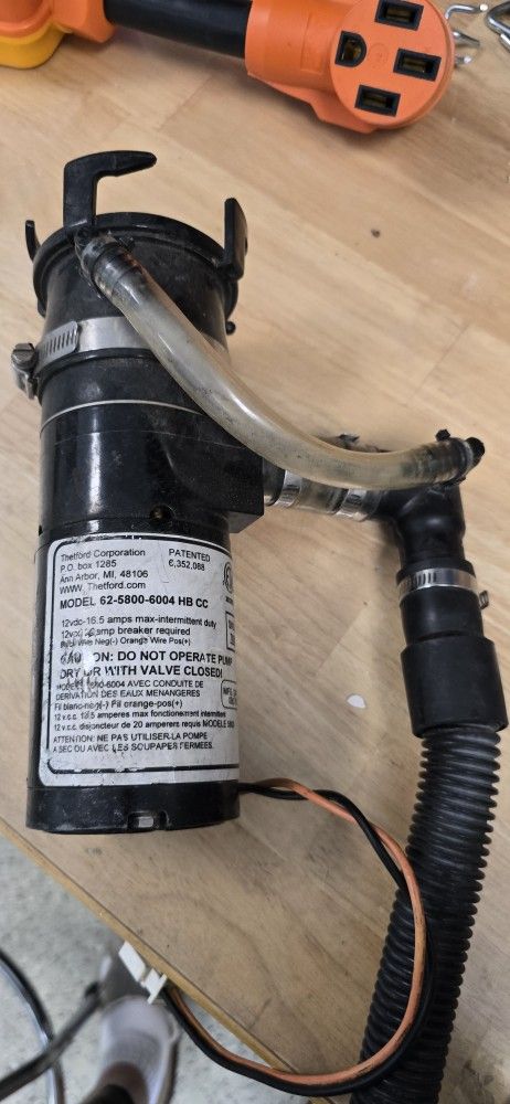 MISELANIOUS RV GREY AND BLACK DRAIN HOSE PARTS. MASERATOR PUMP WITH 16' HOSE