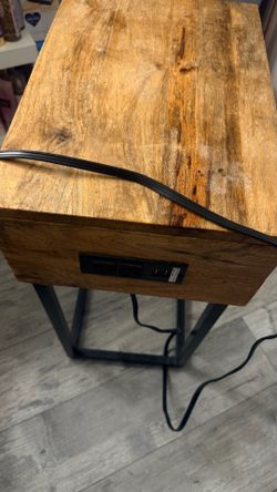 Small end table with outlet