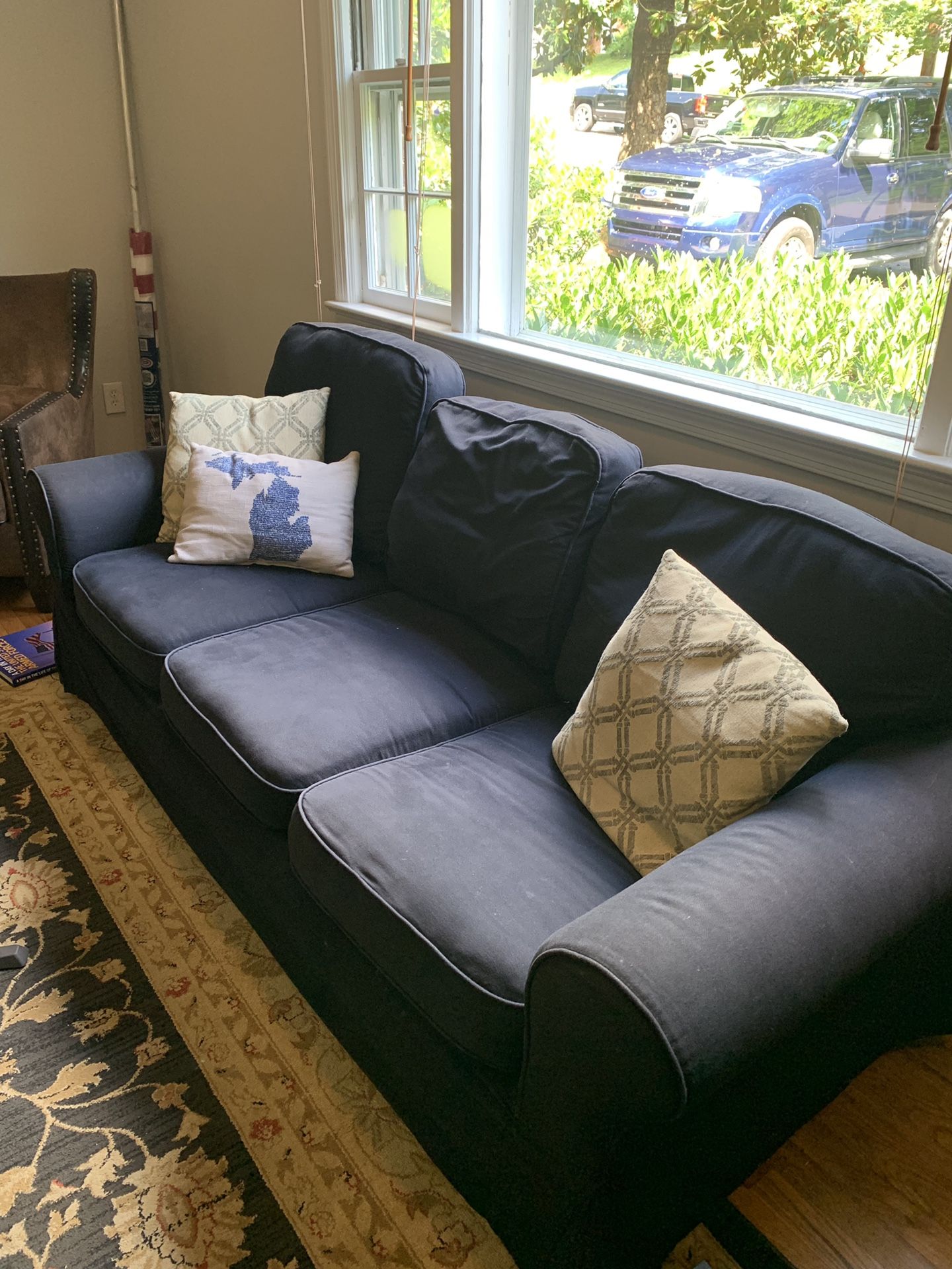 Free! Come get it! Navy couch in fair condition. 84 inches long. Cushion covers are washable and removable.