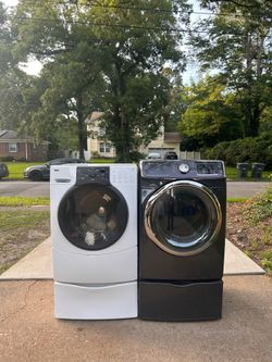 Super capacity frontload washer and dryer set on pedestals