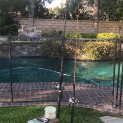 Two saltwater Fishing Rods (Fenwick & 12’) With Penn Jigmaster & Daiwa Sealine Reel Plus Wood Tackle with some Jigs and line.