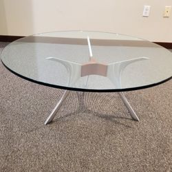 Glass Top coffee table 35 inches in diameter.