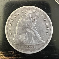1873 seated Liberty dollar. Scratches On Reverse. Cleaned. 