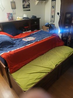 Wooden bed with pull out
