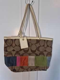 Coach tote bag with brown and beige repeating C logo pattern and colorful patchwork at the bottom #designer #patchwork