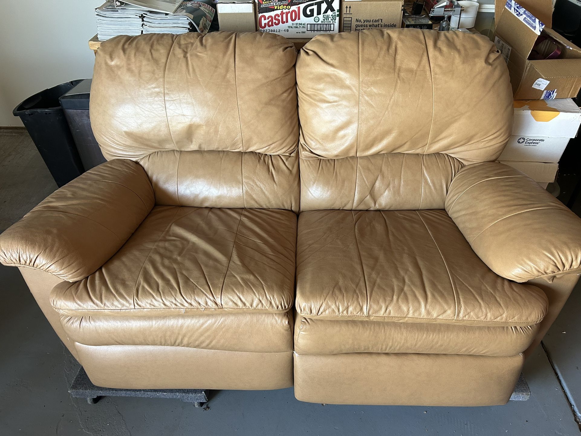 Tan Reclining loveseat.