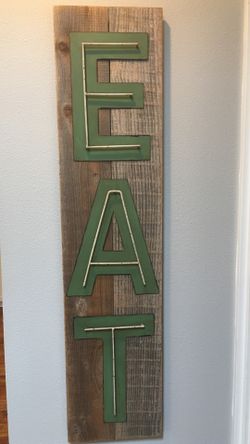 EAT sign on old barnwood