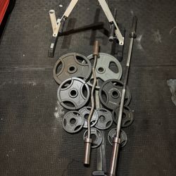 Olympic 6ft bar 35lbs plus 165lbs of Olympic weights and curl bar and weights tree