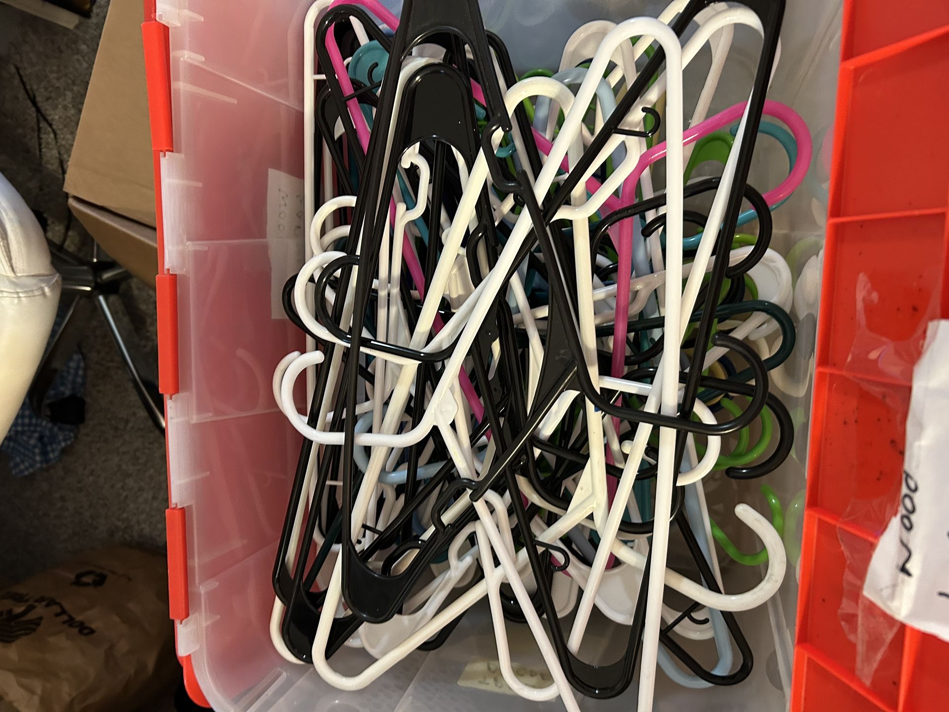 Plastic Hangers In Plastic Tub. You Get 66 Hangers Total.