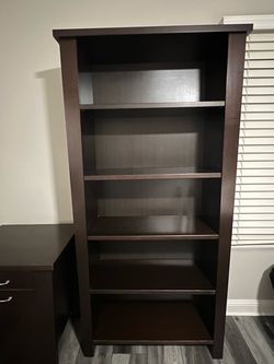 2 matching dark brown wood bookcases
