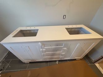 66 inch quartz countertop with matching backsplash.   Cabinet not included.