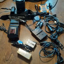 KONICA MINOLTA DIGITAL 35MM CAMERA WITH FLASHER PROGRAMER.   POWER  DRIVE  3 BATTERIES  CONNECTING  CORDS  BATTERY CHARGER  AND  STORAGE  $ 600.