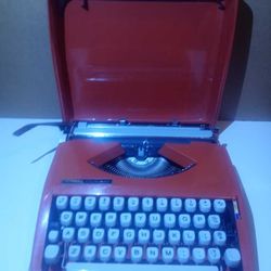 1970s Orange Hermes Rocket Baby Portable Typewriter (working) 

