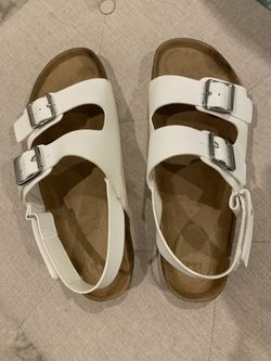 White sandals with buckles