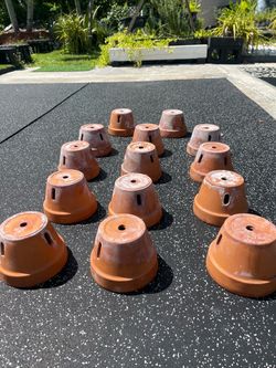 Clay pots, with slots (for orchids)