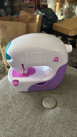 Cool Maker Stitch 'N Style Fashion Studio is a battery-powered toy sewing machine designed for children