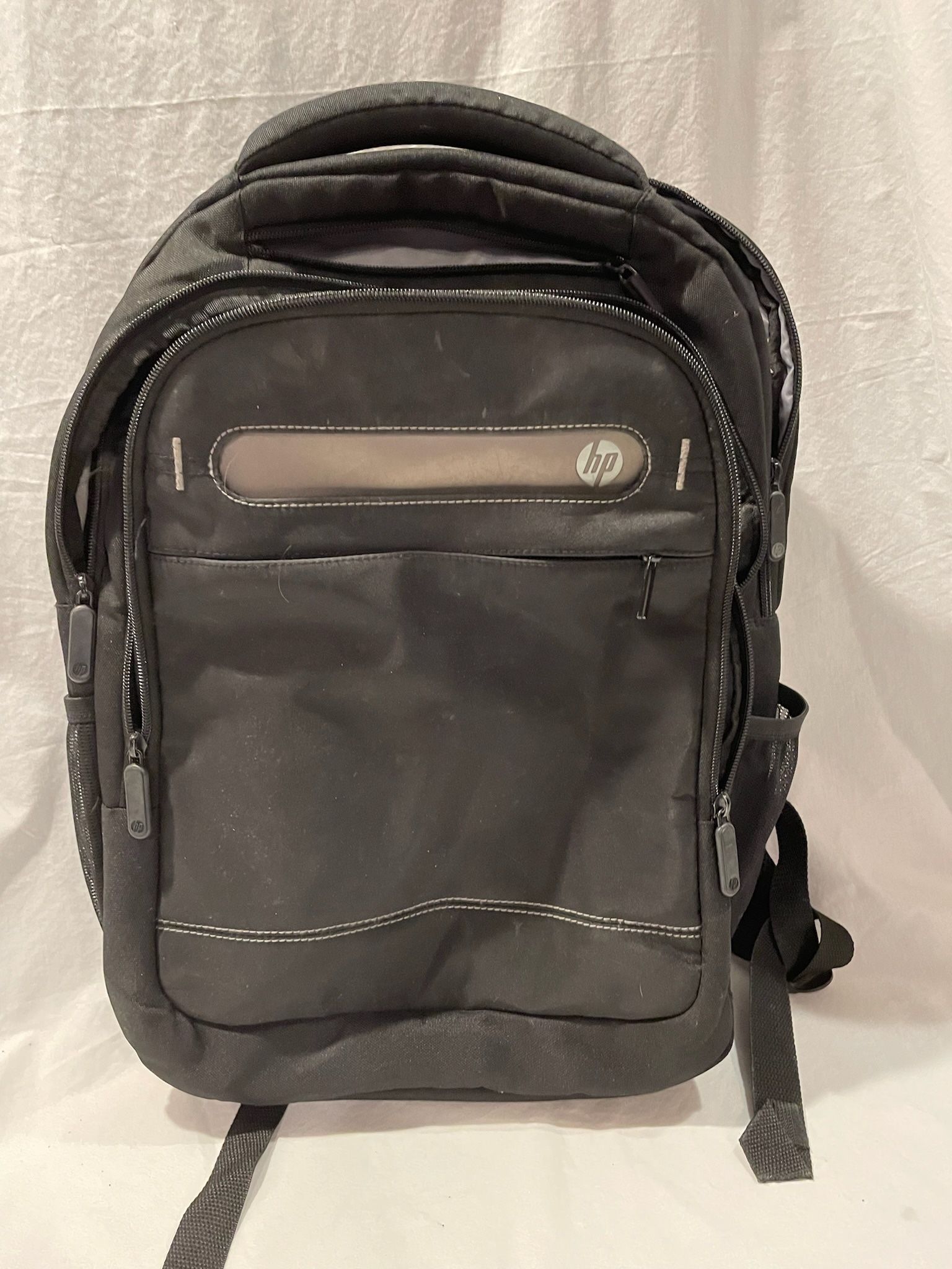 Hewlett Packard black roomy backpack with lots of pockets in EUC HP