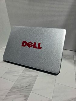 Silver Dell Chromebook with a textured lid and Chrome OS logo. Pink Dell branding on the cover. No visible damage or major wear. CHARGER INCLUDED EVER