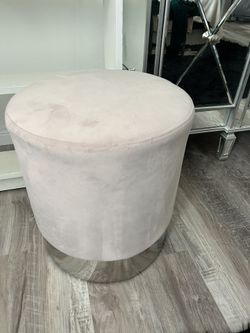 Set of two blush pink with chrome bottom ottomans