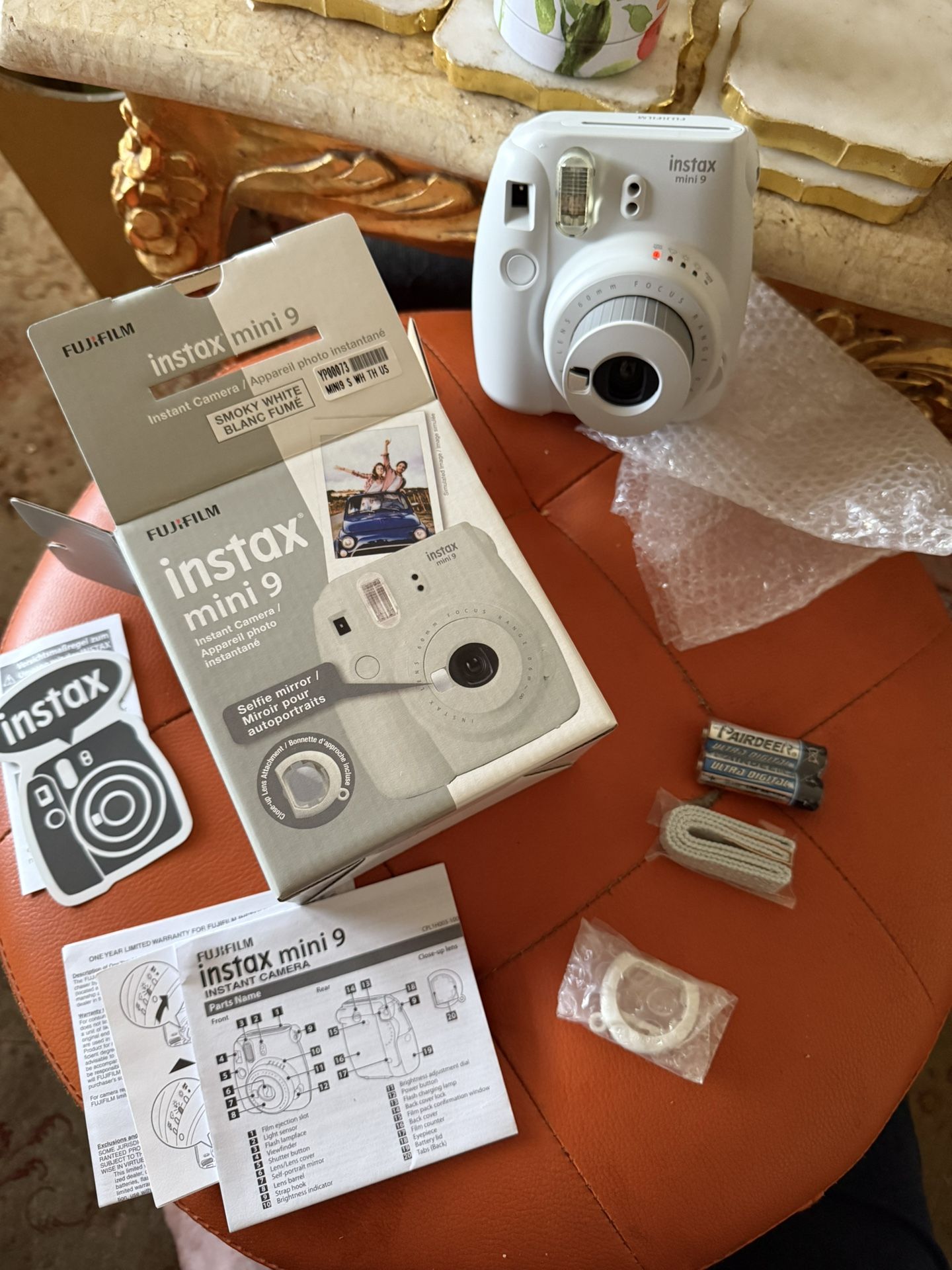 NIB FUJI MINI INSTAX 9 CAMERA SMOKY WHITE TESTED WORKS. COMES WITH CAMERA STAP CLOSE UP LENS AND A SELFIE MIRROR NEW IN BOX