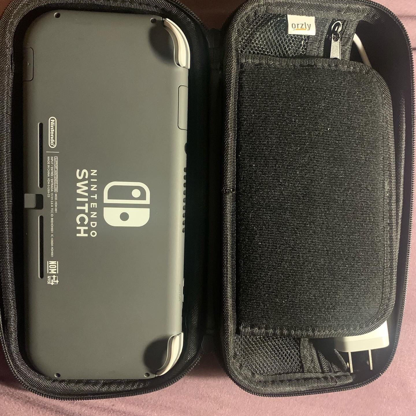 Grey Nintendo Swith Lite (including games and accessories)