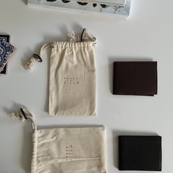 Two Black and Brown Moore & Giles Leather Wallets