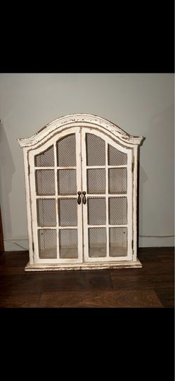 Distressed wood arched cabinet
