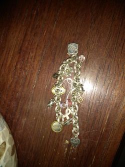 NICE SILVER CHARM BRACLET