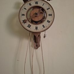 1940s  vintage Swiss-made wooden mechanical wall clock, a mid-century novelty/regulator-style skeleton clock made by Baumann / Bahnmann  in Solothurn,