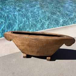 Large, hand-carved wooden slit drum;