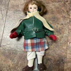 Antique porcelain doll with stand