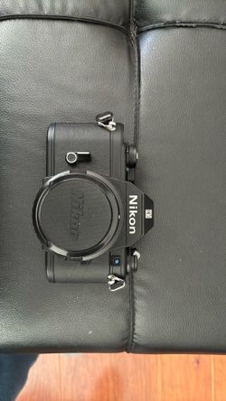 Vintage Nikon EM 35 mm film camera and lens