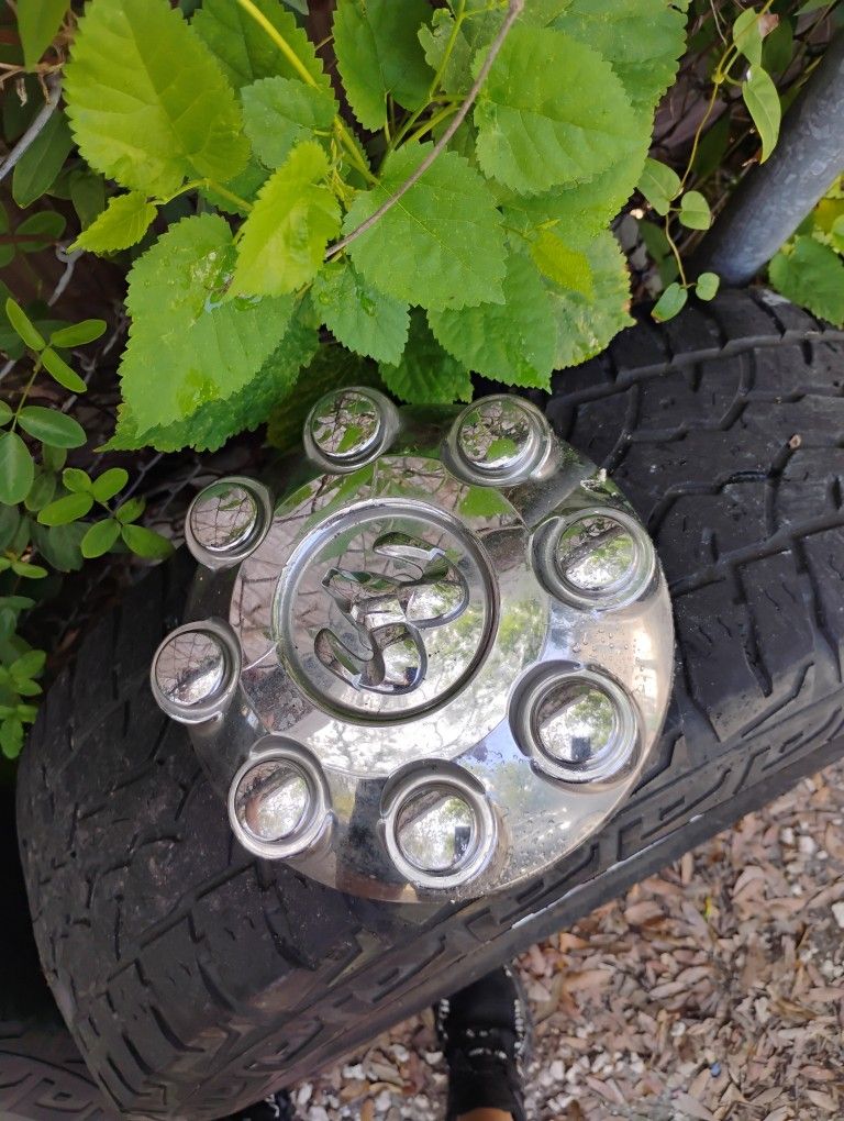 Four Dodge Rims and Hubs With Tires