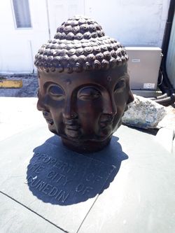 Multiple face Buddha head statue
