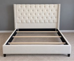 White upholstered, studded, clean bedframe