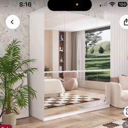 Moving  .. need to sell by Tues Gorgeous Mirrored Armoire brand new In box