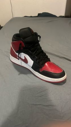 Jordan 1 mid “varsity red”