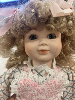 This image shows a vintage-style collectible porcelain doll, likely from the late 20th century.