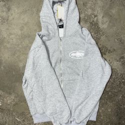 Corteiz Island Puff Print Zip Hoodie – Light Grey (Size M)
