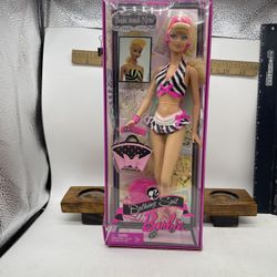 This is the "Bathing Suit Barbie Then and Now 1(contact info removed)" doll. It was released in 2009 to celebrate the 50th anniversary of Barbie
